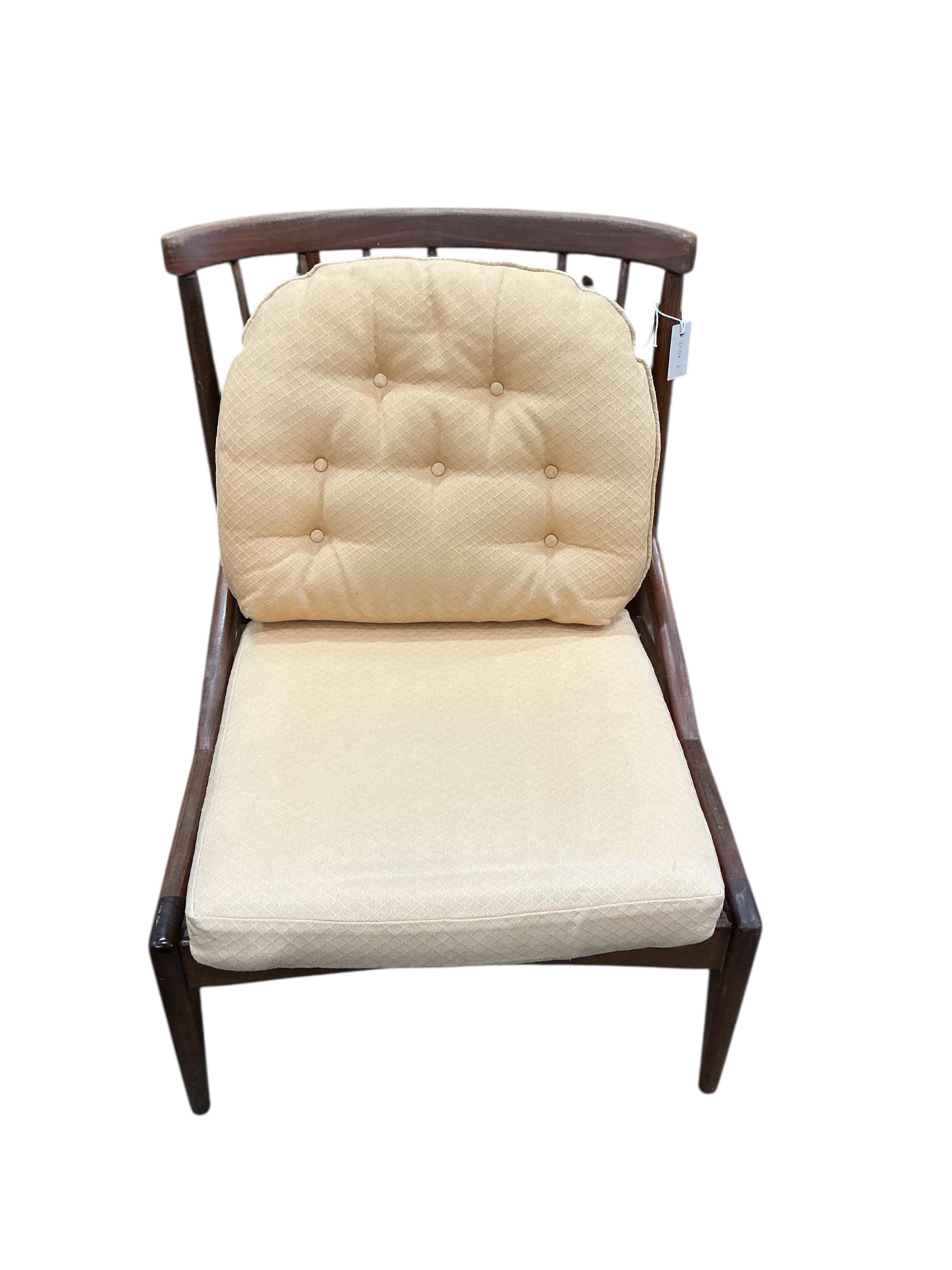 Greaves and Thomas: A pair of mid century stick back armchairs, width 64cm, depth 64cm, height 80cm